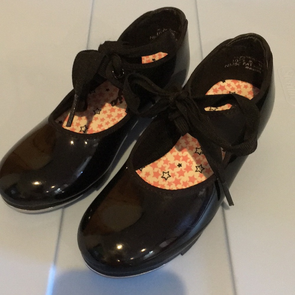 Capezio Black patent tap shoes.